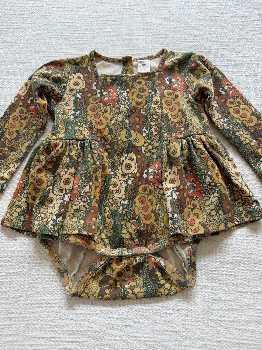 Kate Quinn ruffle bodysuit romper